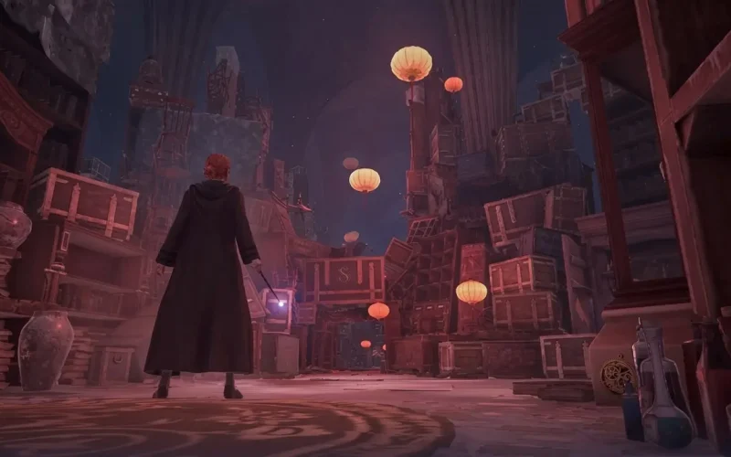 Hogwarts Legacy Deluxe Edition Switch NSP Cloaked character holding a lit wand while exploring a cluttered, lantern-filled ruined hall