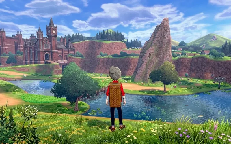 Pokémon Sword Switch NSP Trainer standing by river looking at Galar town with clock tower and rock formation
