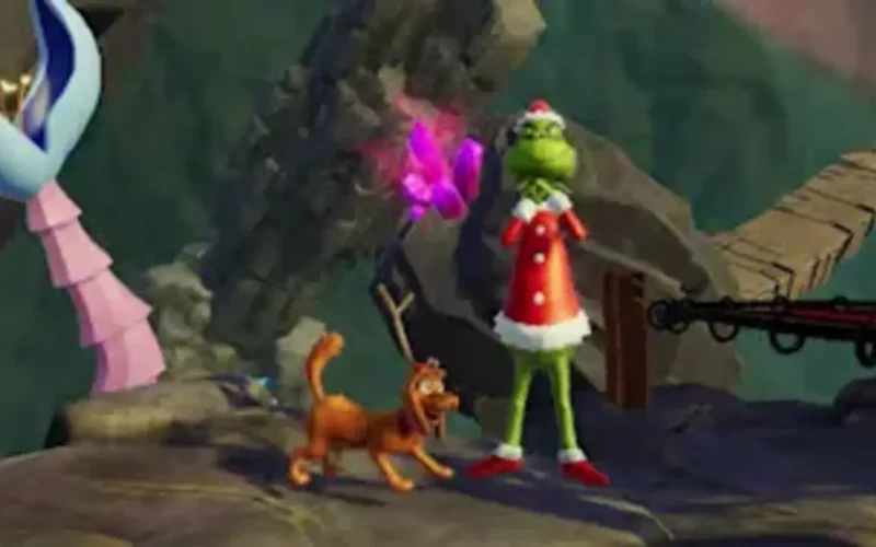The Grinch Christmas Adventures Switch NSP The Grinch in a Santa outfit standing beside his dog Max on a rocky path with a wooden bridge
